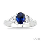 7x5mm Oval Cut Sapphire and 1/3 Ctw Round Cut Diamond Ring in 14K White Gold